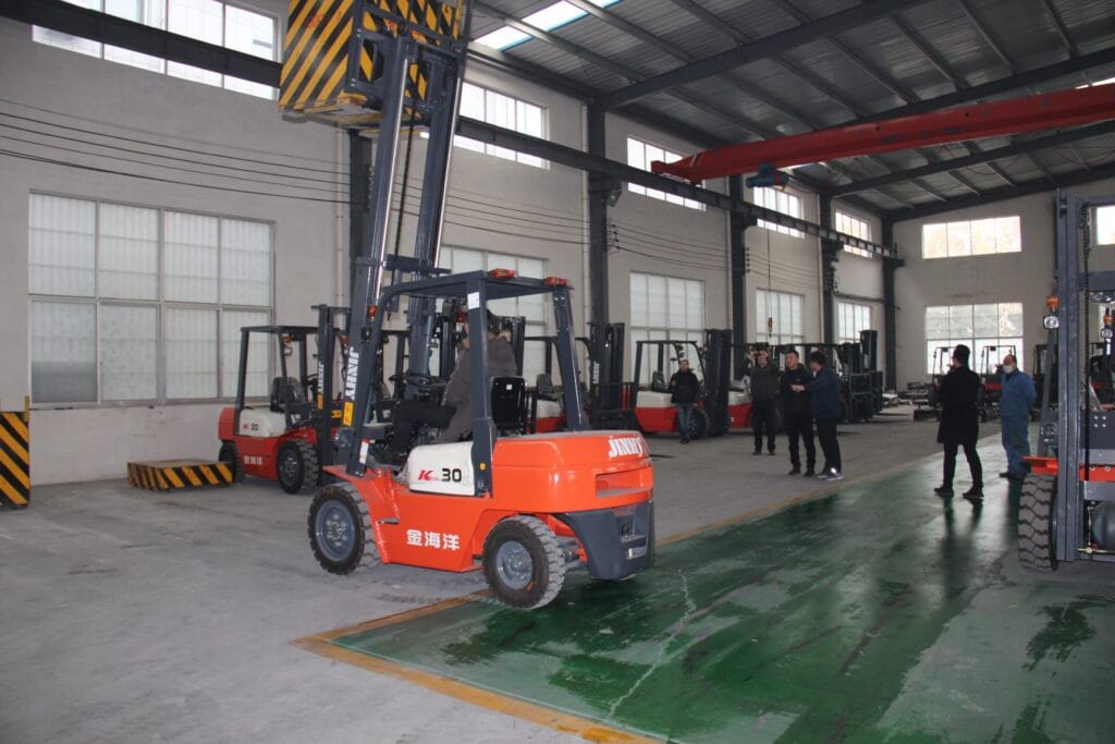 Forklifts operating inside industrial warehouse